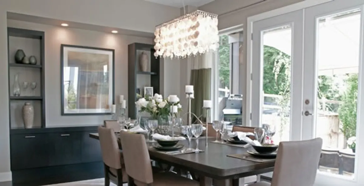 Elegant dining room chandelier installation above table in Las Vegas, NV