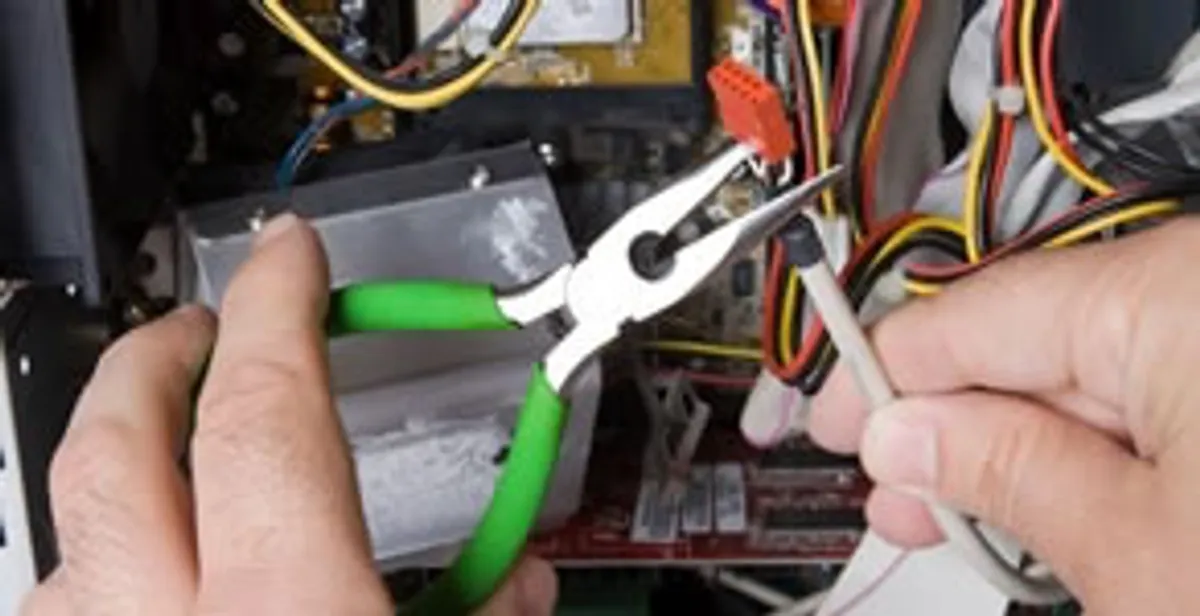 Licensed electrical contractor performing electrical repair with tools in Henderson, NV