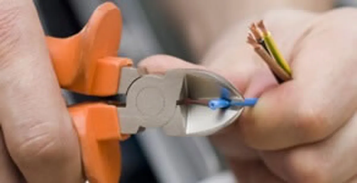 professional electrical services showing precise wire cutting by licensed electricians in Las Vegas, NV