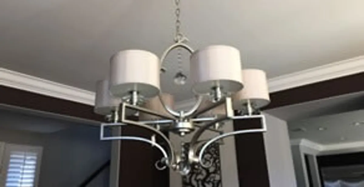 Modern chandelier installation with multiple light fixtures in Las Vegas, NV